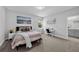 Calming bedroom with a serene atmosphere and a comfortable bed, creating a peaceful retreat at 29912 Cypress Pointe, Deer Island, FL 32778