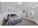 Neutral bedroom with gray accents, two entryways, ample lighting, and a cozy, inviting feel at 29912 Cypress Pointe, Deer Island, FL 32778