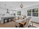 Elegant dining area with modern lighting and open to kitchen, perfect for gatherings at 29912 Cypress Pointe, Deer Island, FL 32778
