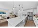 Spacious kitchen island and stainless-steel appliances, perfect for culinary enthusiasts and entertaining guests at 29912 Cypress Pointe, Deer Island, FL 32778