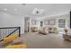 Spacious upper living room with plenty of natural light, comfortable seating, and stylish decor at 29912 Cypress Pointe, Deer Island, FL 32778