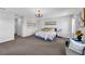 Large main bedroom features a sitting area, a large bed with soft textiles, and plenty of natural light at 29912 Cypress Pointe, Deer Island, FL 32778
