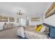 This main bedroom includes a refined chandelier, neutral walls, and soft, textured carpeting creating a calming atmosphere at 29912 Cypress Pointe, Deer Island, FL 32778