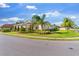 Well-maintained single-story home showcasing lush landscaping, mature trees, and a manicured lawn on a sunny day at 1532 Eagle Ridge Dr, Lakeland, FL 33813