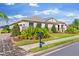 Attractive single-story home with stone detailing, lush landscaping, and a well-manicured lawn at 1532 Eagle Ridge Dr, Lakeland, FL 33813