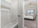 Bright bathroom featuring a soaking tub and a partial view into the Primary bedroom at 1548 Astoria Arbor Ln, Orlando, FL 32824