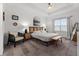 Bright bedroom featuring a white tray ceiling, neutral décor, and ample natural light at 1548 Astoria Arbor Ln, Orlando, FL 32824