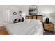 Comfortable bedroom with a queen bed, modern lamps, and stylish nightstands at 1548 Astoria Arbor Ln, Orlando, FL 32824