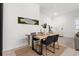 Dining area featuring a modern table setting, sleek chairs, and stylish decor at 1548 Astoria Arbor Ln, Orlando, FL 32824