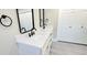 Stylish bathroom vanity featuring double sinks, modern faucets, and ample storage at 2469 Courtland Blvd, Deltona, FL 32738