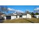 Beautiful single-story home featuring a two-car garage, crisp white facade, and manicured front lawn at 2469 Courtland Blvd, Deltona, FL 32738