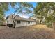 Spacious backyard with mature trees and a partially fenced area at 1228 Se 17Th St, Ocala, FL 34471