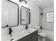 Modern bathroom with double vanity and updated fixtures at 1228 Se 17Th St, Ocala, FL 34471