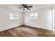 Bright bedroom with two windows and wood floors at 1228 Se 17Th St, Ocala, FL 34471