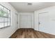 Simple bedroom with wood-look floors and closet at 1228 Se 17Th St, Ocala, FL 34471