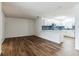 Open concept dining area with wood-look floors and adjacent kitchen at 1228 Se 17Th St, Ocala, FL 34471