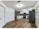 Modern kitchen with white cabinets, stainless steel appliances, and blue tile backsplash at 1228 Se 17Th St, Ocala, FL 34471