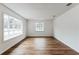 Light-filled living room featuring hardwood floors and large windows at 1228 Se 17Th St, Ocala, FL 34471