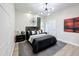 Guest bedroom with a queen bed, dark wood accents, and a window at 2621 Lookout, Kissimmee, FL 34746