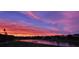 Stunning sunset over calm lake and houses at 2621 Lookout, Kissimmee, FL 34746