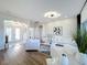 Bright and airy living room with white sofas and a view of the entryway at 2621 Lookout, Kissimmee, FL 34746