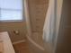 Updated bathroom with tile flooring, shower/tub combo, and vanity at 504 Shiloh St, Fruitland Park, FL 34731