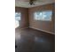 Bedroom with polished floors, neutral walls, and natural light from a double window at 3110 Port Royal Dr, Orlando, FL 32827