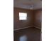 Cozy bedroom featuring a ceiling fan, window, and neutral color scheme at 3110 Port Royal Dr, Orlando, FL 32827