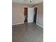 Bedroom with private bathroom access and polished concrete floors at 3110 Port Royal Dr, Orlando, FL 32827