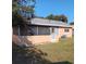 Exterior view of home featuring screened in lanai with backyard and lawn at 3110 Port Royal Dr, Orlando, FL 32827