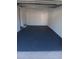 Clean, empty garage with painted floor and walls, ready for parking or storage at 3110 Port Royal Dr, Orlando, FL 32827