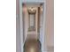 Hallway with multiple doors and a view of the home's interior layout at 3110 Port Royal Dr, Orlando, FL 32827