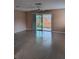 Bright living room with sliding glass doors leading to outdoor space and neutral-toned walls at 3110 Port Royal Dr, Orlando, FL 32827