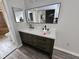 Modern bathroom with double vanity and large mirror at 4520 Summergrove Ave, Orlando, FL 32812