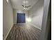 Large bedroom with wood-look floors and ceiling fan at 4520 Summergrove Ave, Orlando, FL 32812