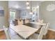 Dining area with a modern marble dining table and pendant lighting, adjacent to the living room at 1301 Tuscan Ter # 9401, Davenport, FL 33896