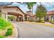 A porte cochere at the entrance of the complex. A parking lot is to the side, as well as landscaping at 1301 Tuscan Ter # 9401, Davenport, FL 33896
