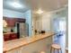 Granite countertops and bar seating define this kitchen area, leading to adjacent rooms at 1301 Tuscan Ter # 9401, Davenport, FL 33896