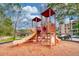Community playground with colorful play structures and a wood chip safety surface at 1301 Tuscan Ter # 9401, Davenport, FL 33896