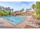 Large community pool with lounge chairs and Mediterranean-style clubhouse in the background at 1301 Tuscan Ter # 9401, Davenport, FL 33896