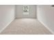 Bright, carpeted bedroom featuring a window offering natural light and neutral wall paint at 3022 Peel Ave, Orlando, FL 32806