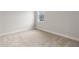 Bedroom showcasing a window and neutral carpet at 3022 Peel Ave, Orlando, FL 32806