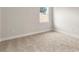 Bright bedroom featuring neutral carpet and a window at 3022 Peel Ave, Orlando, FL 32806