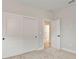 Bedroom with sliding closet doors and neutral carpeting at 3022 Peel Ave, Orlando, FL 32806
