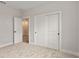 Bedroom features neutral carpeting, closet and access to en-suite bathroom at 3022 Peel Ave, Orlando, FL 32806