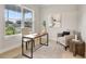 Comfortable home office features natural light, minimalist decor, a work desk and modern furnishings at 3022 Peel Ave, Orlando, FL 32806