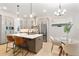 Contemporary kitchen with a central island, stainless steel appliances, and an adjacent breakfast nook at 3022 Peel Ave, Orlando, FL 32806