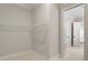 Large walk-in closet with ample shelf and hanging space for efficient storage at 3022 Peel Ave, Orlando, FL 32806
