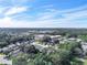 Wide aerial view of neighborhood, showing houses and surrounding area at 2907 Willow Oak Ct, Kissimmee, FL 34744