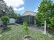 Screened patio with pavers and lush landscaping at 2907 Willow Oak Ct, Kissimmee, FL 34744